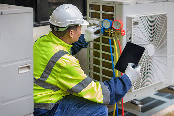 Professional Heat Pump Repair technician working in DeFuniak Springs, FL